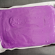 Cake pan lined with parchment paper and filled with cake batter
